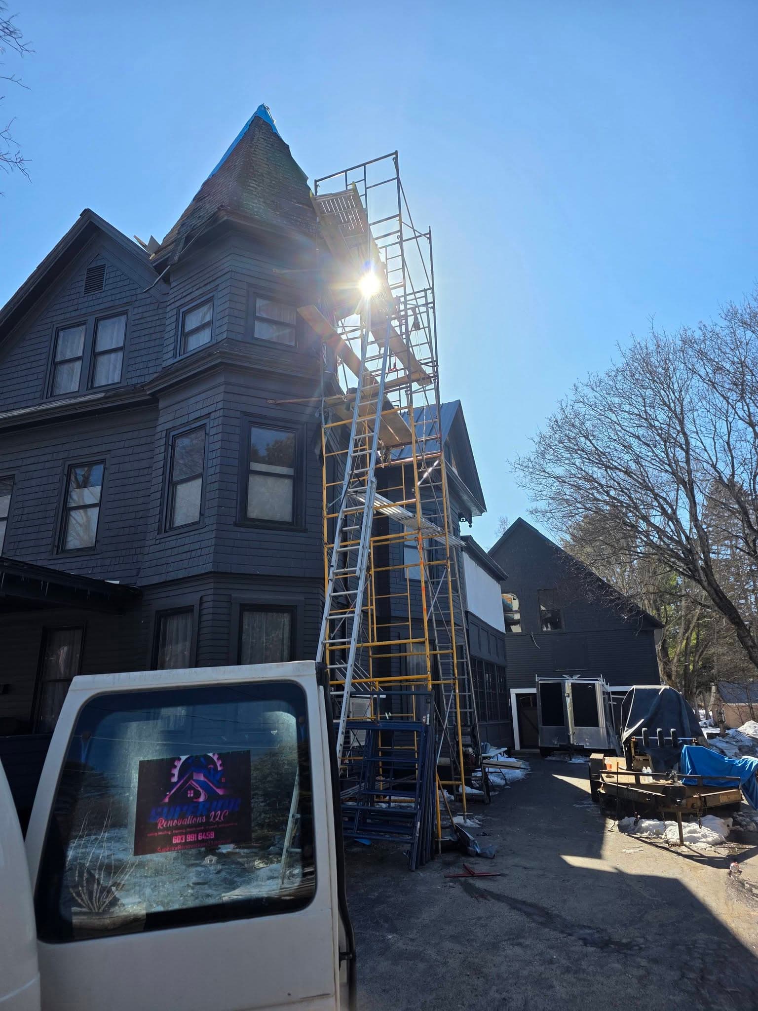 Scaffolding set up along a Victorian home during a roof and exterior restoration